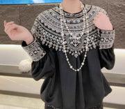 Loose satin blouse with long sleeves and batwing neck, with embroidered beads and high-quality sequins