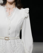 Elegant white midi dress with embroidery long sleeves of high quality