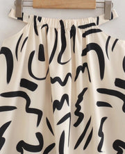 Hollow Out Waist Flare Skirt Graffiti Print Strapless Tops Set