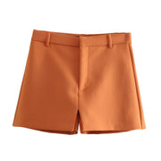 Set of short orange jacket with hem and collar, elegant shorts